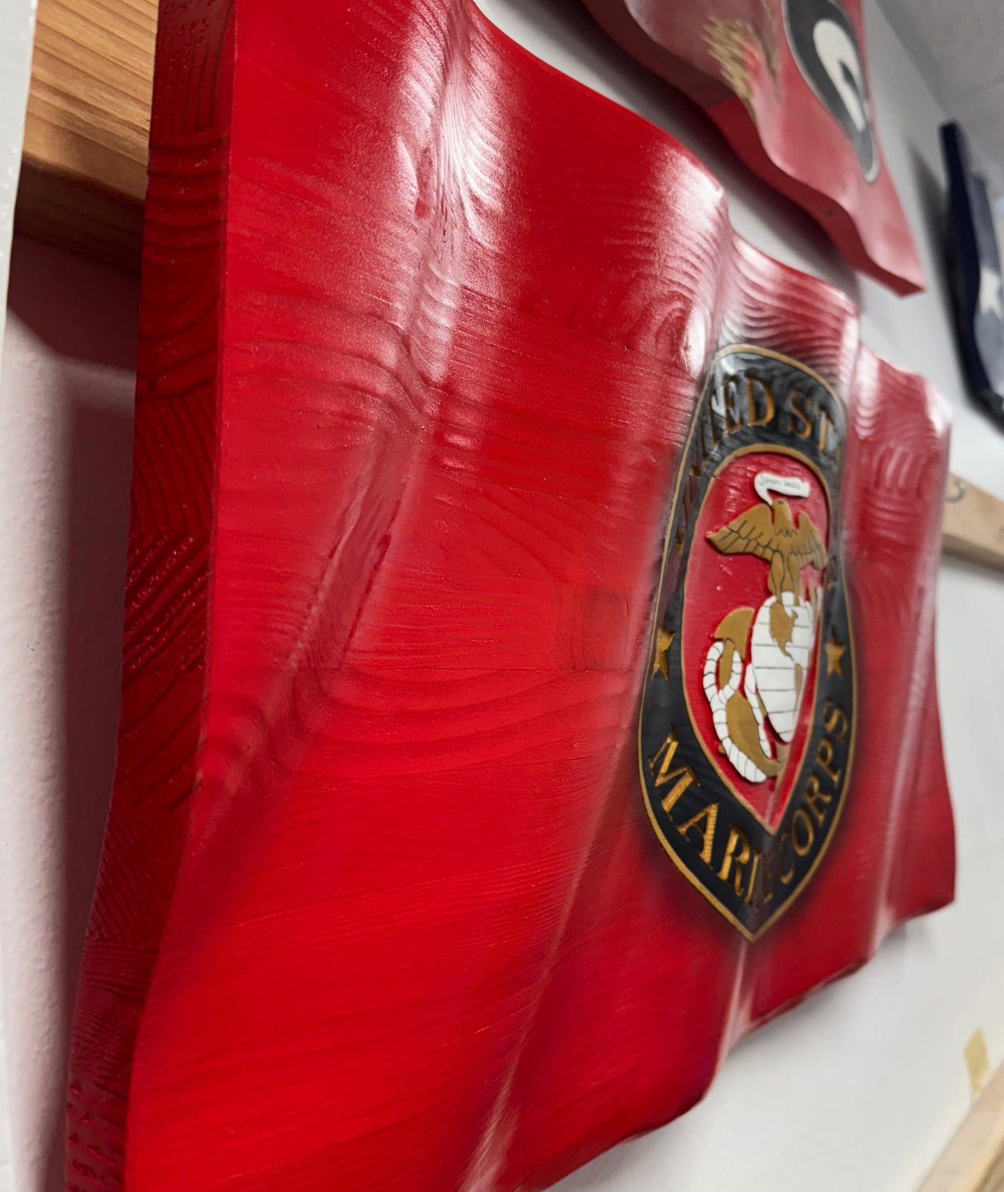 Red surface with a prominent emblem featuring text and an eagle design.